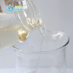 Amber-colored APG (Alkyl Polyglucoside) liquid surfactant being poured, showing viscosity and flow characteristics