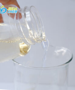 Pour the pale yellow CAB/CAPB from the small bottle into the beaker