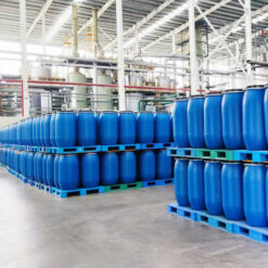 Industrial warehouse storing LABSA (Linear Alkylbenzene Sulfonic Acid) in IBC totes and drums, organized chemical storage