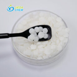 Glyceryl Stearate (And) PEG-100 Stearate scooped out from the transparent small bowl with a small black spoon