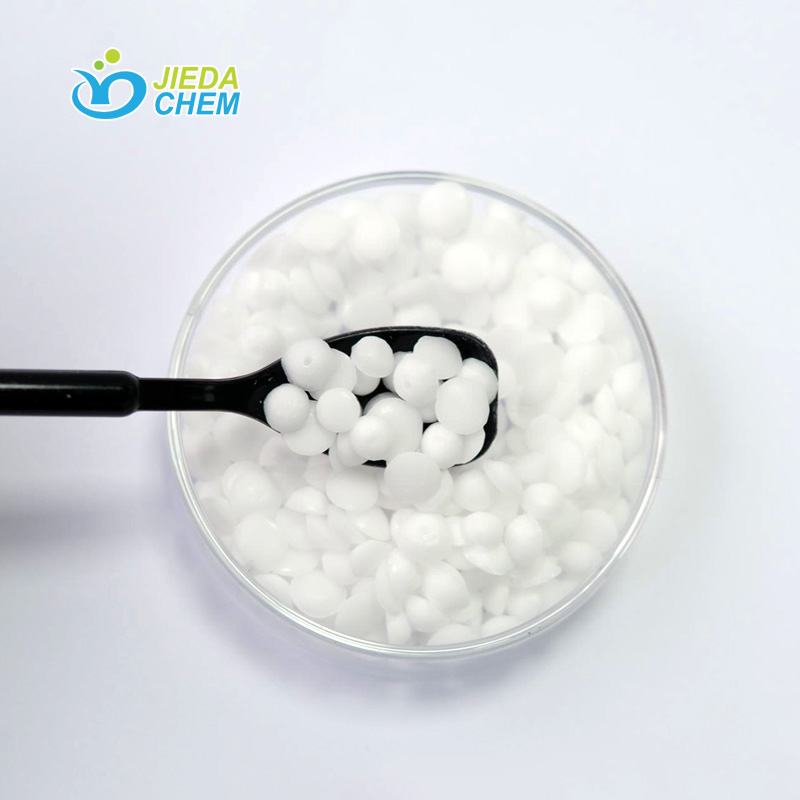 Cetearyl Alcohol (And) PEG-20 Stearate scooped out from the transparent small bowl with a small black spoon