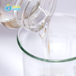 The transparent liquid Peg-6 Caprylic/Capric Glycerides contained in the small bottle is being poured into the beaker