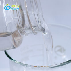 The transparent liquid Peg-8 Caprylic/Capric Glycerides contained in the small bottle is being poured into the beaker