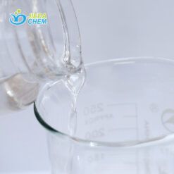 The transparent liquid Isononyl Isononanoate contained in the small bottle is being poured into the beaker