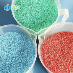 blue, green, red Colorful speckles for laundry detergent, showcased in transparent plates