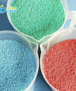 blue, green, red Colorful speckles for laundry detergent, showcased in transparent plates