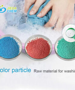 The Color speckles of blue, green and red in a small plate, with the background picture of washing clothes