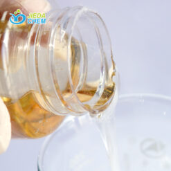 Pour the transparent liquid disodium lauroamphodiacetate from the small bottle into the beaker