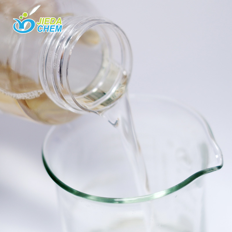 The transparent liquid Sodium lauroyl sarcosinate in the small bottle is poured into the beaker