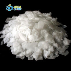 Close-up of white flake Sodium Hydroxide