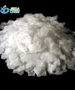 Close-up of white flake Sodium Hydroxide