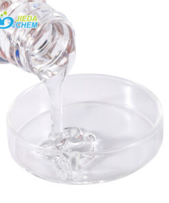 Clear liquid Panthenol being poured into a transparent plate, showing its smooth flow and high transparency