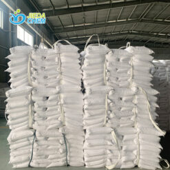 Packed white bags of calcium carbonate