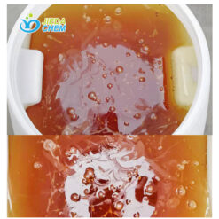 IBC packaging of Benzalkonium Chloride solution with close-up of amber viscous liquid flow